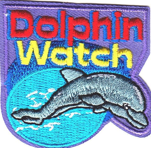 דולפין צפה בברזל על האוקיאנוס דג ים טלאים
