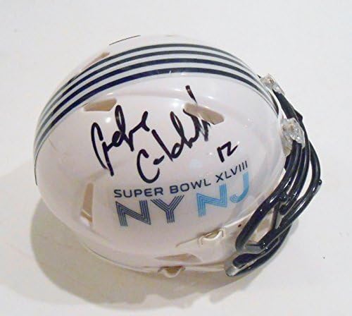 אנדרה קולדוול חתם על קסדה מיני של סופרבול 48 עם קסדות מיני עם חתימה
